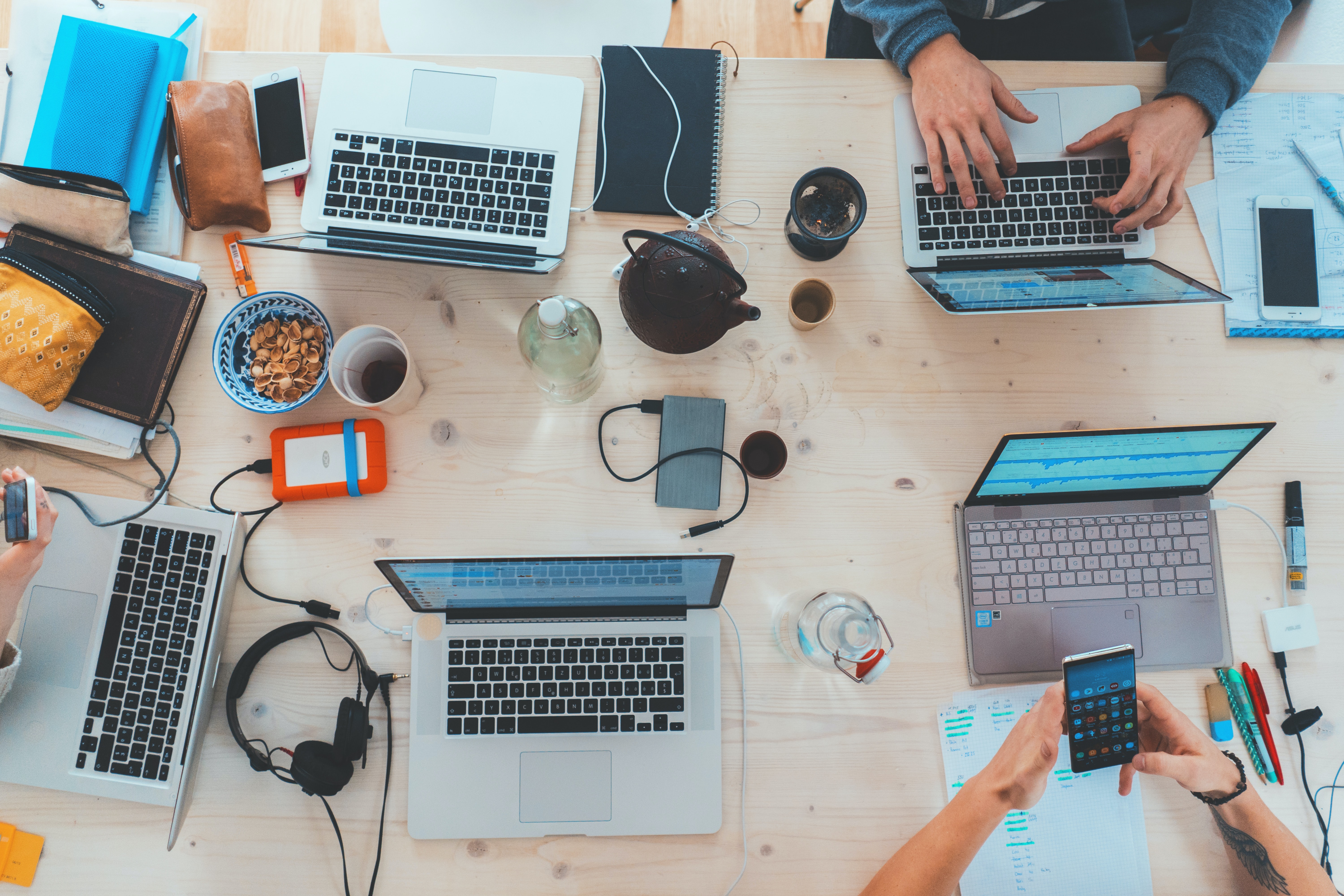 Top-down view of a desk with laptops