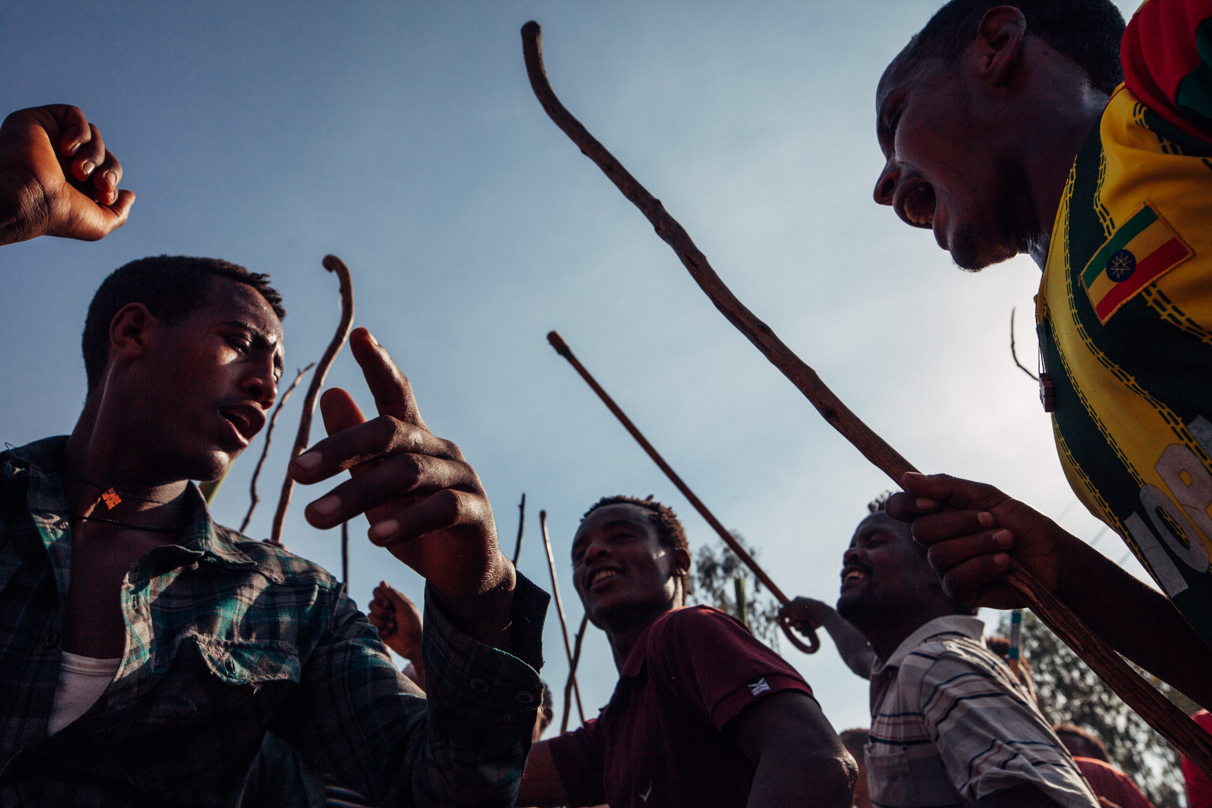 Men dancing and singing at Timkat Festival in Lalibela, Ethiopia